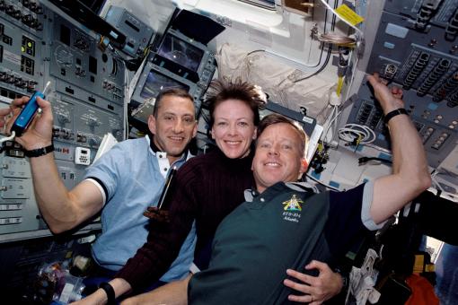 Close quarters - Atlantis astronauts happily shared the same air and small spaces, with a
multitude of surfaces, on space shuttle mission 104 in 2001. They are,
from the left, Charles O. Hobaugh, pilot; Janet L.
Kavandi, flight engineer and mission specialist; and Steven W. Lindsey,
commander.